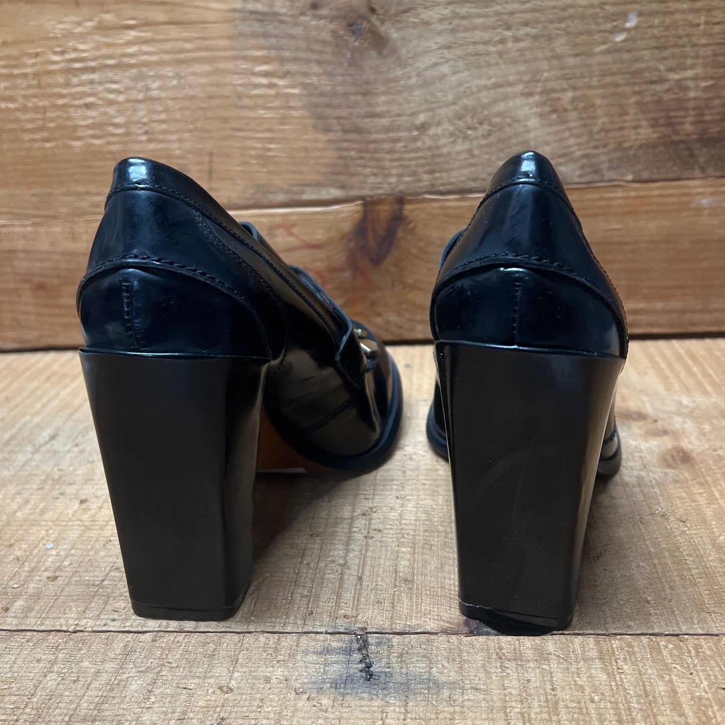 LUXURY REBEL Women's High Healed Gold-tipped Kiltie Penny Loafer Pump. 37EU/US 6.5-7  Black Polished Leather