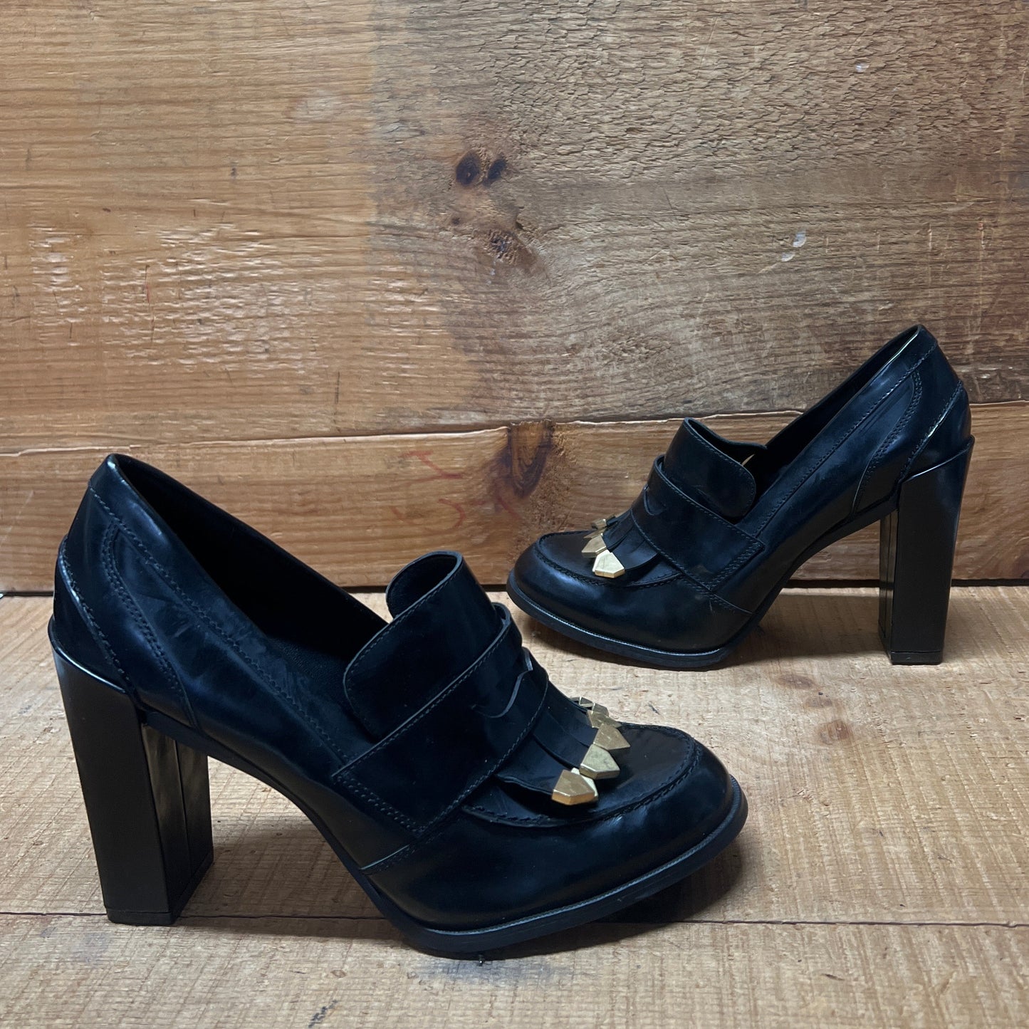 LUXURY REBEL Women's High Healed Gold-tipped Kiltie Penny Loafer Pump. 37EU/US 6.5-7  Black Polished Leather