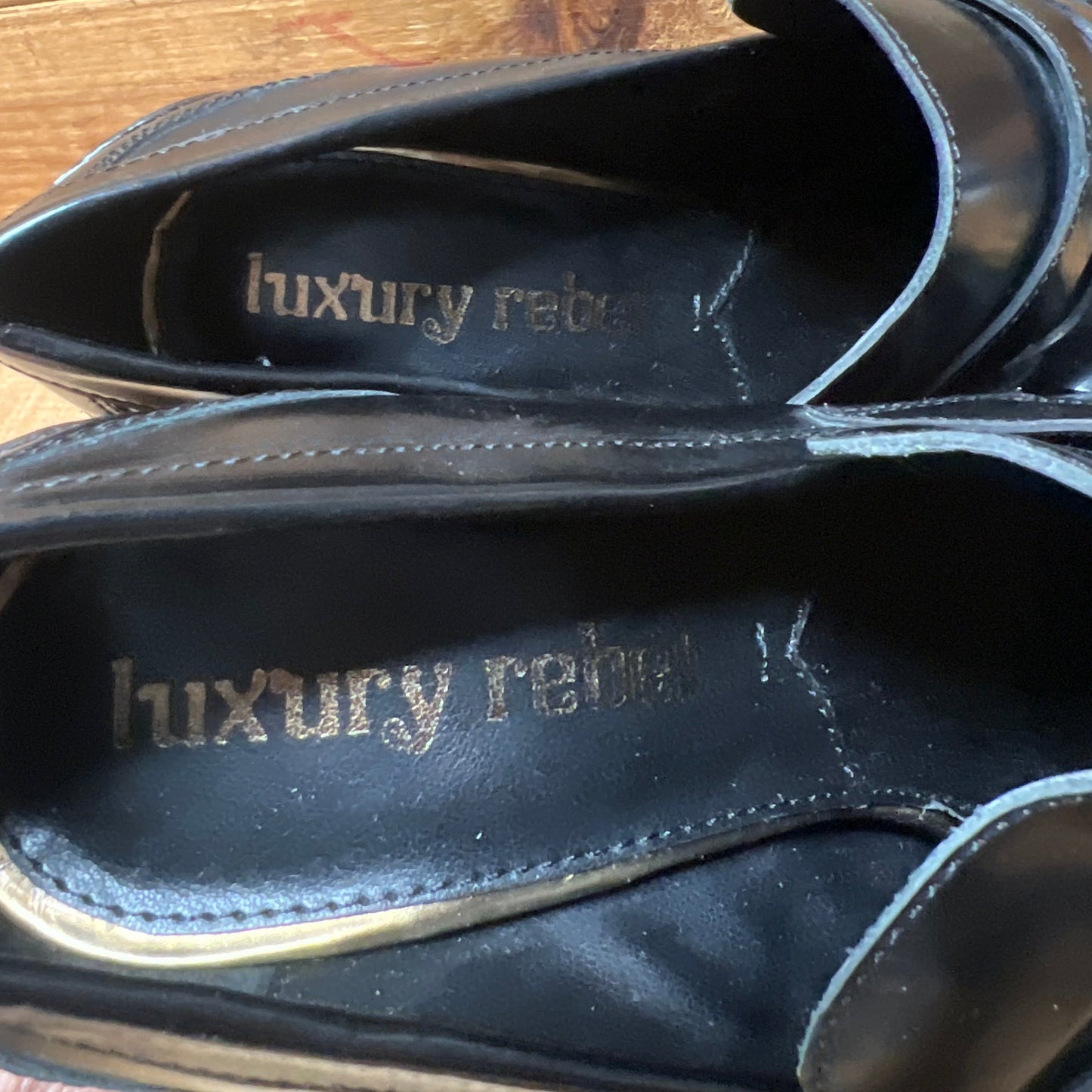 LUXURY REBEL Women's High Healed Gold-tipped Kiltie Penny Loafer Pump. 37EU/US 6.5-7  Black Polished Leather